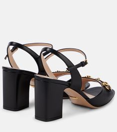 Horsebit leather sandals in black - Gucci | Mytheresa Gucci Block Heel Sandals With Buckle Closure, Gucci Sandals With Buckle Closure And Block Heel, Gucci Sandals With Buckle And Block Heel, Luxury Calf Leather Slingback Sandals, Luxury Calf Leather Slingback Sandals With Ankle Strap, Luxury Calf Leather Ankle Strap Slingback Sandals, Gucci Block Heel Shoes With Buckle Closure, Elegant High Heel T-strap Sandals With Leather Sole, Luxury Open Heel Heels With Buckle Closure