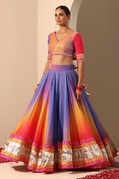 Multi colored lehenga with gota and lampi border. Comes with multi colored back tassel blouse with gota work and soft net dupatta.
Components: 3
Neckline: V Neck
Sleeve Type: Elbow
Fabric: Lehenga and Blouse: Organza, Dupatta: Soft Net
Color: Multi Color
Other Details: 
Length:
Lehenga: 40 inches
Dupatta: 2.5 mtrs
Dupatta width: 44 inches
Note: Potli bag held by the model is not for sale
Occasion: Destination Wedding - Aza Fashions Anarkali Lehenga With Multicolor Mirror Work, Anarkali Style Multicolor Lehenga With Mirror Work, Bollywood Style Multicolor Lehenga For Navratri, Navratri Multicolor Lehenga With Traditional Drape, Multicolor Navratri Sets With Gota Work, Multicolor Gota Work Sets For Navratri, Multicolor Mirror Work Choli For Reception, Multicolor Choli With Mirror Work For Reception, Bollywood Style Multicolor Gota Work Choli