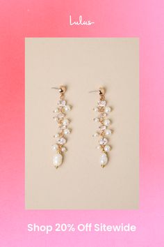 If you have an instinct for elegance, you need the Lulus Decadent Approach Gold Pearl Rhinestone Drop Earrings! Shiny, gold-toned metal shapes these stunning earrings that have a drop silhouette with various sizes and cuts of rhinestones (along with luminous faux pearls) strung across their length. Post backs. 3" long. 40% Iron, 40% Plastic, 20% Pearl. Imported. Lulus | Decadent Approach Gold Pearl Rhinestone Drop Earrings. Gold-tone Drop Earrings For Wedding, Elegant Jeweled Crystal Earrings Gold Plated, Elegant Gold-tone Crystal Drop Earrings, Elegant Gold Plated Jeweled Crystal Earrings, Gold-tone Metal Earrings For Wedding, Gold Linear Drop Earrings With Sparkling Stones, Wedding Crystal Pearl Drop Earrings, Gold-tone Crystal Earrings For Party, Pierced, Gold-tone Pearl Drop Earrings For Party