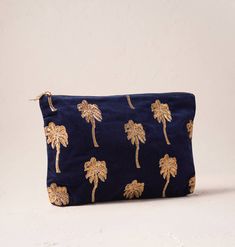 Navy Velvet Inspired by far-flung destinations, this golden palm design features glistening embroidery on a sumptuous navy velvet base. A symbol of escapism and idyl, these palm accessories are set to accompany your summertime adventures. Designed to make your life a little more organised and a lot more luxurious, this timeless Everyday Pouch features delicate embroidery on a soft, durable base. Ideally sized, it is perfect for storing your daily essentials, fitting in your handbag, or using as Elizabeth Scarlett, Palm Design, Teal Velvet, Teenager Gifts, Navy Velvet, Gifts For New Mums, Beautiful Gifts, Travel Pouch, Luxury Gifts