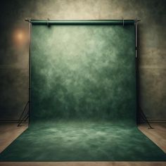 an empty photo studio with green backdrop