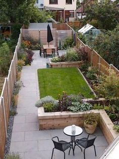 an outdoor garden with tables and chairs