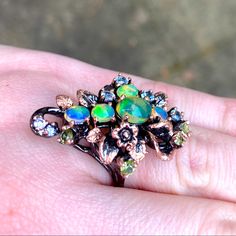 Gorgeous Extravagant Ring. Ethiopian Opal With Topaz, Peridot And Cz Accents. 925 Silver With Black Rhodium And Rose Gold Plating. Please See Photos And Let Me Know If You Have Any Questions. Weight Is 8.9 Grams Offers Are Welcome. Thank You For Looking! Related: Engagement Ring Diamond 10k 14k 18k Filled Platinum Necklace Bracelet Vermeil Cut Carat Floral Flower Fine Dainty Vintage Jewelry Cut Carat Anniversary Wedding Opal Emerald Ruby Onyx Bridal Antique Pink Rose Sapphire Citrine Quartz Druz Opal Tiara, Platinum Necklace, Pearl Tiara, Ethiopian Opal Ring, Rose Gold Accents, Engagement Ring Diamond, Antique Pink, Mystic Topaz, Black Rhodium