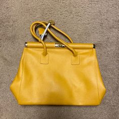 Bought It In Italy And Never Used. Leather! Office Yellow Shoulder Bag With Detachable Handle, Yellow Leather Satchel With Gold-tone Hardware, Gold Top Handle Satchel In Soft Leather, Yellow Shoulder Bag With Gold-tone Hardware And Top Handle, Yellow Top Handle Shoulder Bag With Gold-tone Hardware, Yellow Shoulder Bag With Top Handle And Gold-tone Hardware, Yellow Leather Shoulder Bag For Office, Yellow Top Handle Satchel For Office, Yellow Office Shoulder Bag With Adjustable Strap