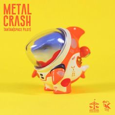 an orange, white and blue toy is on a yellow background with the words metal crash