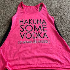 a pink tank top that says hakuna some vodka it means get wasted