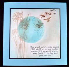 a card with an image of birds and flowers in the sky, on a blue background