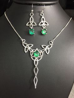 I will fabricate this Celtic Knot necklace and earring set for you, in sterling silver, with 8mm gemstone choices in the drop-down menu. This is a lovely Celtic inspired jewelry set which will enhance your wedding theme, cosplay event, or the Irish lass within! I fabricated the necklace using 5 sterling silver Trinity knots with a center 8mm gem (shown with sapphire, Emerald as examples) and I've then solder attached a 16 inch sterling silver box chain to either jumping on opposing ends. The tot Silver Emerald Jewelry Sets For Gift, White Gold Sterling Silver Jewelry Sets With Gemstones, Formal Sterling Silver Gemstone Jewelry Sets, Silver Sterling Silver Emerald Necklace For Anniversary, Polished May Birthstone Jewelry For Weddings, Sterling Silver Pendant Jewelry Sets, Sterling Silver Green Gemstone Jewelry Sets, Sterling Silver Jewelry For May Birthstone, Silver Sterling Silver Hallmarked Emerald Necklace