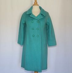 "Vintage! In excellent condition! This beautiful coat is heavy! It's definitely 100% wool. It has a very cute inside pocket with two little cute bows. There is some light discoloration on left shoulder and sleeve. Teal/blue drop shoulder style bust: 19.25\" length (from central back): 34.5\" sleeve length: 23.25\" from the seam of the collar Please remember that vintage items are not mint, nor are they perfect but they sure are full of old history and charm. Every item is authentic vintage, one- Vintage Long Sleeve Pea Coat With Button Closure, Vintage Wool Coat With Button Closure, Vintage Blue Outerwear With Button Closure, Vintage Wool Double-breasted Outerwear, Vintage Blue Single-breasted Outerwear, Vintage Japan, Cute Bows, Wool Coat, Teal Blue