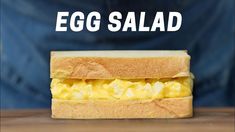 an egg salad sandwich is shown with the words egg salad on it's side