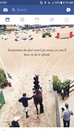 an image of a person riding a horse in the middle of a dirt area with people watching