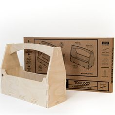 a wooden tool box sitting next to a cardboard box