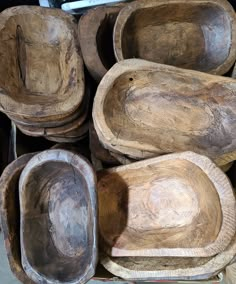 several wooden bowls stacked on top of each other