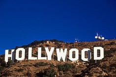 the hollywood sign is on top of a hill