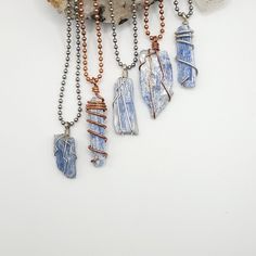 Raw Blue Kyanite necklace wrapped with real sterling silver wire or pure copper wire. It includes a ball chain or black or brown faux suede cord (cord adjusts from 12"-24") If you prefer a sterling silver chain, you can find them here - https://www.etsy.com/listing/757293463/sterling-silver-rolo-chain?ga_search_query=chain&ref=shop_items_search_1 ◇ Meaning  Blue Kyanite has a high vibration and rapid transfers of energy. It is an extraordinary crystal of connection, and immediately aligns the chakras and subtle bodies, bringing tranquility and a calming effect to the whole being. Kyanite neither accumulates nor retains negative energy, and therefore never needs cleansing, and it may be used for cleansing and clearing other crystals. ◇ Please do not hesitate to contact me for custom orders Adjustable Blue Wire Wrapped Crystal Necklace, Blue Wire Wrapped Crystal Necklace For Healing, Blue Kyanite Crystal, Subtle Bodies, Kyanite Necklace, Kyanite Crystal, Suede Cord, Blue Kyanite, Rolo Chain