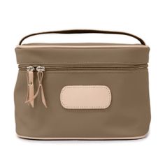 PERFECT Gift for Valentines Day! This makeup case from Jon Hart is perfect for any lady! Features include an interior pocket for small, easily lost items (looking at you, tweezers); a natural leather handle for easy transport; and a vinyl-coated canvas that makes it durable for daily use. Beige Rectangular Cosmetic Bag, Beige Rectangular Cosmetic Bag For Everyday Use, Cream Rectangular Cosmetic Bag For Travel, Rectangular Cream Travel Cosmetic Bag, Beige Portable Rectangular Cosmetic Bag, Portable Rectangular Beige Cosmetic Bag, Rectangular Brown Cosmetic Bag For Travel, Beige Travel Cosmetic Bag With Zipper, Beige Zipper Pouch Cosmetic Bag For Travel