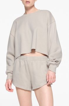 You'll want to lounge all day in this supersoft fleece pullover in a relaxed silhouette with a raw, cropped hem from Kim Kardashian's SKIMS. 18" length (size Medium) Crewneck Dropped shoulders Ribbed cuffs 70% cotton, 30% polyester Machine wash, tumble dry Imported Twd Rick Grimes, Cropped Crewneck, Rick Grimes, Fleece Shorts, Gym Shirts, Crew Sweatshirts, Crop Sweatshirt, Cotton Fleece, Long Tops