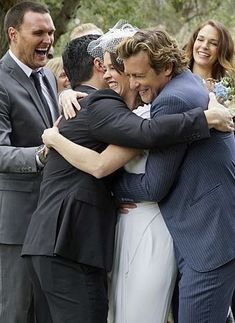 a group of people that are hugging each other