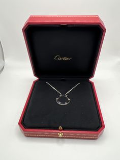 Genuine Cartier Love Collection Necklace. The necklace as well as the Original 16 inch chain are crafted of 18K White gold. The Piece is approximately 23.5mm wide and has a Gross Weight of 14.1 Grams. Hallmarked Cartier AU 750 and a Serial number. The necklace comes with the original inner and outer boxes and Cartier Certificate and is in very good condition. Would make a Great Addition to any Jewelry Collection Round Necklaces With Polished Finish For Evening, Polished Round Necklace For Evening, Evening White Gold Necklace With Polished Finish, Diamond Cut Pendant Necklaces For Evening, Diamond Cut Pendant Necklace For Evening, Evening Pendant Necklace With Diamond Cut, Fine Jewelry Round Pendant Necklace For Evening, Luxury Clavicle Chain Jewelry For Formal Events, Luxury Engraved Diamond Necklace For Formal Occasions