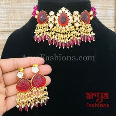 Bridal Pacchi Kundan Jadau Choker Emerald Ruby Necklace/ Indian Wedding Jewelry Made in Brass with 22 karat gold plating, Pacchi kundan and semi precious beads Handcrafted To Perfection Light Weight Choker Necklace Perfect For Indian Weddings And Celebrations A Beautiful & Memorable Gift for Weddings or engagement. Necklace: Adjustable to neck Earrings: 3 Inches Earrings come with push back closure Meenakari 22k Gold Bridal Necklace For Puja, Heavy 22k Gold Kundan Necklace For Puja, Kundan Choker With Latkans For Wedding, Wedding Kundan Choker With Latkans, Traditional Red Kundan Necklace In 22k Gold, Ruby Meenakari Bridal Necklace For Celebration, Festive Ruby Kundan Necklace For Puja, 22k Gold Bridal Necklace With Stone Work For Celebration, Festive Red Kundan Necklace In 22k Gold