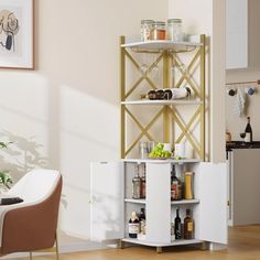 a white cabinet with shelves filled with bottles and condiments next to a chair