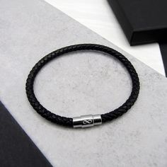 Looking for the perfect gift to give your other half? Then look no further than our men's leather bracelet with lasered infinity symbol to show the love of your life just how much you care about them, also an ideal 3rd anniversary gift for hubby. PLEASE NOTE - OUR SIZES ARE 'TO FIT A WRIST SIZE' AND NOT TOTAL LENGTH Our bracelets come in 4 colours black, brown, grey and navy in both sizes 19cm and 21cm, finally comes with a choice of single or double stranded leather, so the choice is yours. Mad Minimalist Leather Bracelet With Stainless Steel Clasp, Black Infinity Bracelet For Friendship, Black Infinity Friendship Bracelet, Stylish Jewelry Accessories, Gifts For Hubby, Mens Bracelets, 3rd Anniversary Gifts, Jewelry Mens, Infinity Jewelry