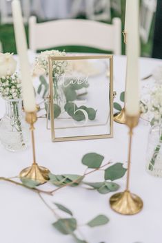 the table is set with candles and flowers