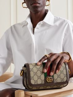 It's hard to deny the timeless appeal of Gucci's 'Ophidia' series, and this mini shoulder bag is a fine example. Crafted in Italy from signature coated-canvas, it's mapped with the house's unmistakable 'GG' monogram, first unveiled in the '30s, and finished with smart leather trims. The compact size fits your phone, wallet and keys. Mini Bag Outfit, Gucci Monogram Bag, Gucci Mini Bag, Gucci Crossbody Bag, Loungewear Outfits, Sequin Bag, Gucci Ophidia, Gucci Crossbody, Flat Dress Shoes