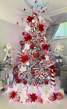 a christmas tree decorated with candy canes and bows