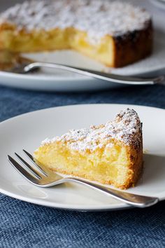 a piece of cake sitting on top of a white plate with a fork next to it