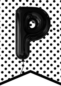 the letter p is made up of black and white polka dot paper with a balloon attached to it