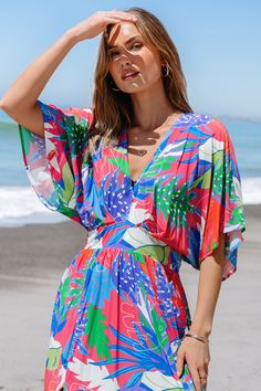 Embrace weekend vibes in the Bright Tropical Smocked Maxi Dress. Perfect for brunch with friends or a family gathering, its easy-going style and bright print make every day feel like a getaway. Product code: CAA05A4D165EE Features:  Knit V-neck Smocked waist Maxi Pattern: Tropical Material: 100%RAYON. Multicolor V-neck Beach Dress With Floral Print, Multicolor V-neck Beach Dress For Vacation, Colorful Printed Beach Dress, Multicolor V-neck Beach Dress With Vibrant Print, Multicolor V-neck Vibrant Print Beach Dress, Holiday V-neck Floral Print Beach Dress, Spring Beach Maxi Dress With Bold Print, Spring Bold Print Maxi Dress For Beach, Vacation Floral Print Maxi Dress For Brunch