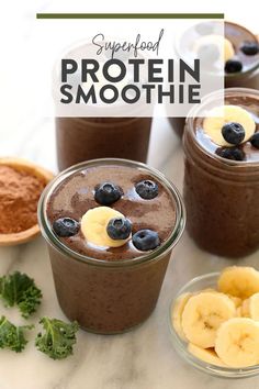 chocolate smoothie with banana slices and blueberries in the middle, surrounded by other ingredients