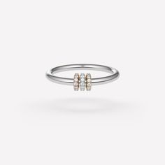 The Sirius is an iconic ring, with a minimalist, unisex design that puts material first. Featuring a band of either .925 sterling silver or 18k yellow gold adorned with three unfixed annulets, the Sirius is stunning worn alone or as an orbiting addition to other Spinelli Kilcollin rings. Individually handmade in Los Angeles. Minimalist 14k Gold Band With Vvs Clarity, Minimalist Vvs Clarity Jewelry For Promise Ring, Modern Rose Gold Sterling Silver Ring, Timeless White Gold Initial Ring With Round Band, Minimalist Diamond Rings With Polished Finish, Minimalist White Gold Diamond Stackable Rings, Everyday White Gold Stackable Ring With Single Diamond, White Gold Stackable Rings With Single Diamond For Everyday, Everyday Fine Jewelry White Gold Rings