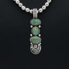 The High Lonesome Turquoise mine is known for its khaki green turquoise that always contains a golden matrix. The color combination is certainly one of our favorite here at Silver Sun. Ruth Ann Begay’s silversmithing turns this pendant into something extraordinary. Size: 55 x 14 mm Stones (top to bottom): 11 x 6, 8 x 10, 11 x 7 mm Bale: 10 x 9 mm Luxury Untreated Turquoise Necklace In Sterling Silver, Green Chrysoprase Oval Pendant Jewelry, Southwestern Green Turquoise Necklace With Large Pendant, Southwestern Turquoise Necklace With Large Green Pendant, Green Turquoise Necklace With Large Southwestern Pendant, Green Oval Pendant Necklace With Engraving, Green Oval Pendant Necklace Engraved, Green Chrysocolla Pendant Jewelry, Sterling Silver Pendant Jewelry With Patina