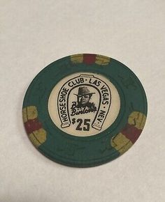 a green and yellow poker chip with the number 25 on it