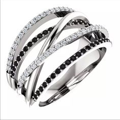 a white gold ring with black and white diamonds