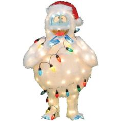 an inflatable character with christmas lights on it's chest and arms, wearing a santa hat