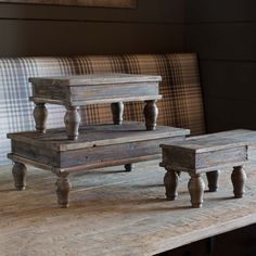 three pieces of furniture sitting on top of a table