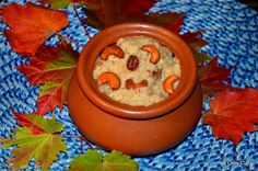 a bowl filled with oatmeal and nuts on top of a blue table cloth