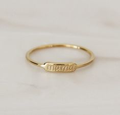 "A dainty, every day ring perfect for mamas and mamas to be. A sentimental piece that will be cherished by all beautiful mamas. Makes the perfect push present, Mother's Day gift, or gift for oneself * Featuring a tiny bar with \"mama\" in our signature script. Photo is a close up image for details. Please refer to our measurements for scale/sizing. Shown paired with our Grace Band. Please note this listing is for the mama ring only. ⚫ Base Material: High Quality Surgical Steel Finish: 18K Gold, Adjustable Everyday Rings Stamped 14k, Adjustable 14k Stamped Rings For Everyday, Minimalist 14k Gold Hand Stamped Ring, Minimalist Hand Stamped Rings For Everyday, Minimalist Hand Stamped Yellow Gold Ring, Minimalist Everyday Hand Stamped Rings, Everyday Minimalist Hand Stamped Rings, Dainty Adjustable Engraved Ring For Everyday, Adjustable Engraved Name Ring For Everyday