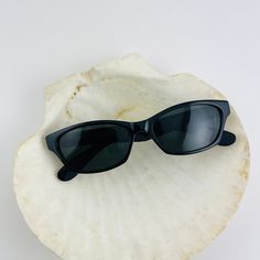 These chic cat eye sunglasses are your everyday classic. Featuring a black frame with black smoke lens. This style is unisex. True genuine vintage sunglasses from the 90s. - 400 uv - new vintage from the 90s - includes sunglasses pouch Available in other colors Red tortoise https://etsy.me/30WoyTI Brown Tortoise https://etsy.me/37PsEx8 Vintage Cat Eye Wayfarer Sunglasses With Gradient Lenses, Vintage Cat Eye Sunglasses With Anti-reflective Coating, Vintage Cat Eye Sunglasses With Gradient Lenses, Retro Black Cat Eye Sunglasses, Retro Black Sunglasses With Gradient Lenses, Vintage Cat Eye Sunglasses With Uva Protection, Vintage Black Cat Eye Sunglasses, Black Retro Sunglasses With Gradient Lenses, Vintage Black Sunglasses For Summer