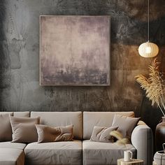 a living room filled with furniture and a large painting hanging on the wall above it