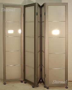 an open room divider with three doors on each side