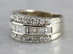 two wedding bands with white diamonds on them