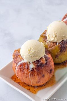 two pastries on a plate with ice cream