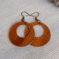 These modern and minimalist leather circle earrings are the perfect look for everyday. Create your own custom earrings by choosing from the 10 leather options then pair them with ear wires in antique brass, antique silver, or antique copper. Lightweight and easy to wear - you might forget you are wearing them!  I use only genuine full grain vegetable tanned leather chosen for its high quality and excellent durability. The leather will age beautifully and develops fabulous character over time.  D Handmade Leather Everyday Earrings, Handmade Leather Earrings For Everyday, Everyday Handmade Leather Earrings, Handmade Earrings For Everyday Use, Handmade Brown Earrings For Everyday Use, Classic Everyday Leather Jewelry, Handmade Leather Hoop Earrings, Handmade Minimalist Leather Earrings, Handmade Brown Hoop Earrings For Everyday Wear