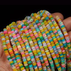 AAA+ Ethiopian Opal Disco Smooth Rondelle Bead Welo Opal Bead Multi Color Opal Cut Rondelle beads Opal Plain Beads Fire Opal Beads Stone: Opal Shape: Rondelle  Style: Faceted Beads Size: 3-5.5 mm approx Quality: AAA+ Grade High Quality If You Wants More Pictures Of Products Please Feel Free For Any Queries And Send Us Your Whatsapp Number That Will Help Us To Send You More Pictures And Every Detail Of Product. These Are Natural Gemstones Therefore, Variation In The Shade & Quality Is Expected. Gemstone Picture Shown Are Of Actual Gemstone That You Will Receive, However, The Color & Appearance May Look Slightly Different Depending On Your Monitor Resolution & Climatic Condition. Some Imperfections Can Be Expected As Stones Are Natural. If Required, Please Ask Us To Show The Lot Image Before Bohemian Rondelle Spacer Beads, Multicolor Rondelle Bohemian Beaded Necklaces, Multicolor Rondelle Beaded Bohemian Necklaces, Multicolor Bohemian Rondelle Beaded Necklaces, Colorful Faceted Beaded Bracelets, Rainbow Faceted Beads Bracelet For Jewelry Making, Multicolor Faceted Oval Beads Bracelet, Rainbow Faceted Beads Bracelets, Multicolor Polished Round Beads Bracelet