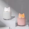 there are two cakes that look like cats on top of each other, one is pink and the other is white