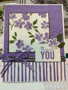 a thank you card with purple flowers on it